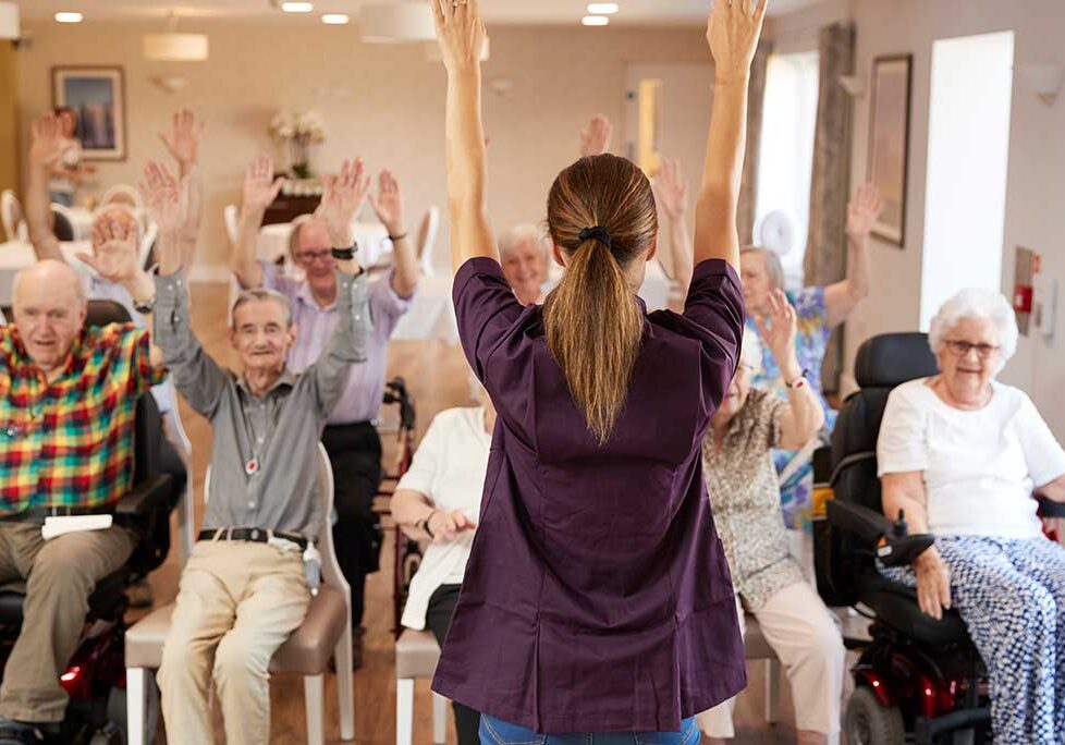 Woman Leading Elderly Excercise Group